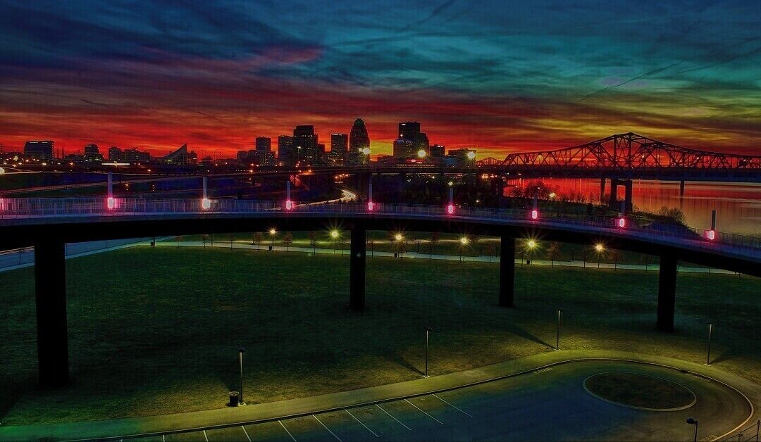 A bridge with a city skyline in the background.