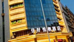 A hotel with a modern facade, multiple balconies, and a prominent sign. - Shishi Live DNG Hotel (Shishi)