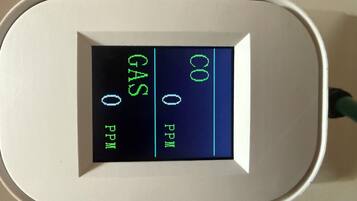 A digital display with CO, GAS, and PPM readings.