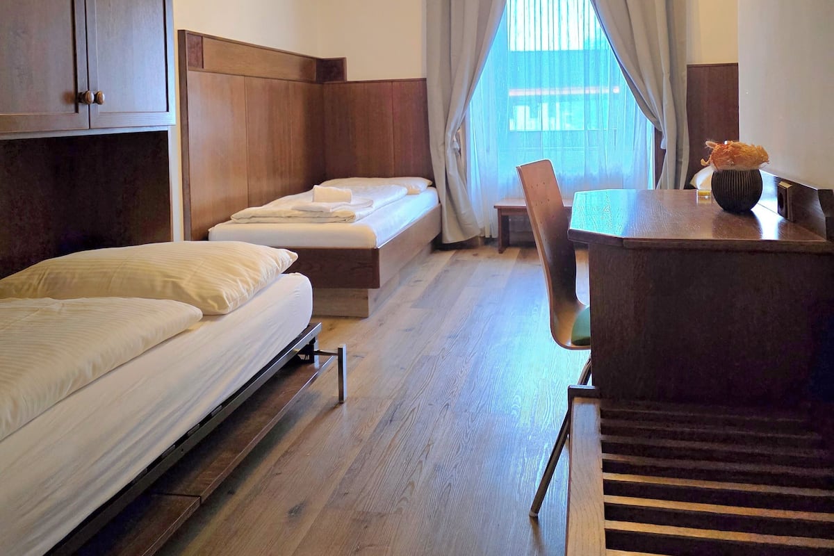Standard Triple Room | Desk, laptop workspace, blackout curtains, soundproofing