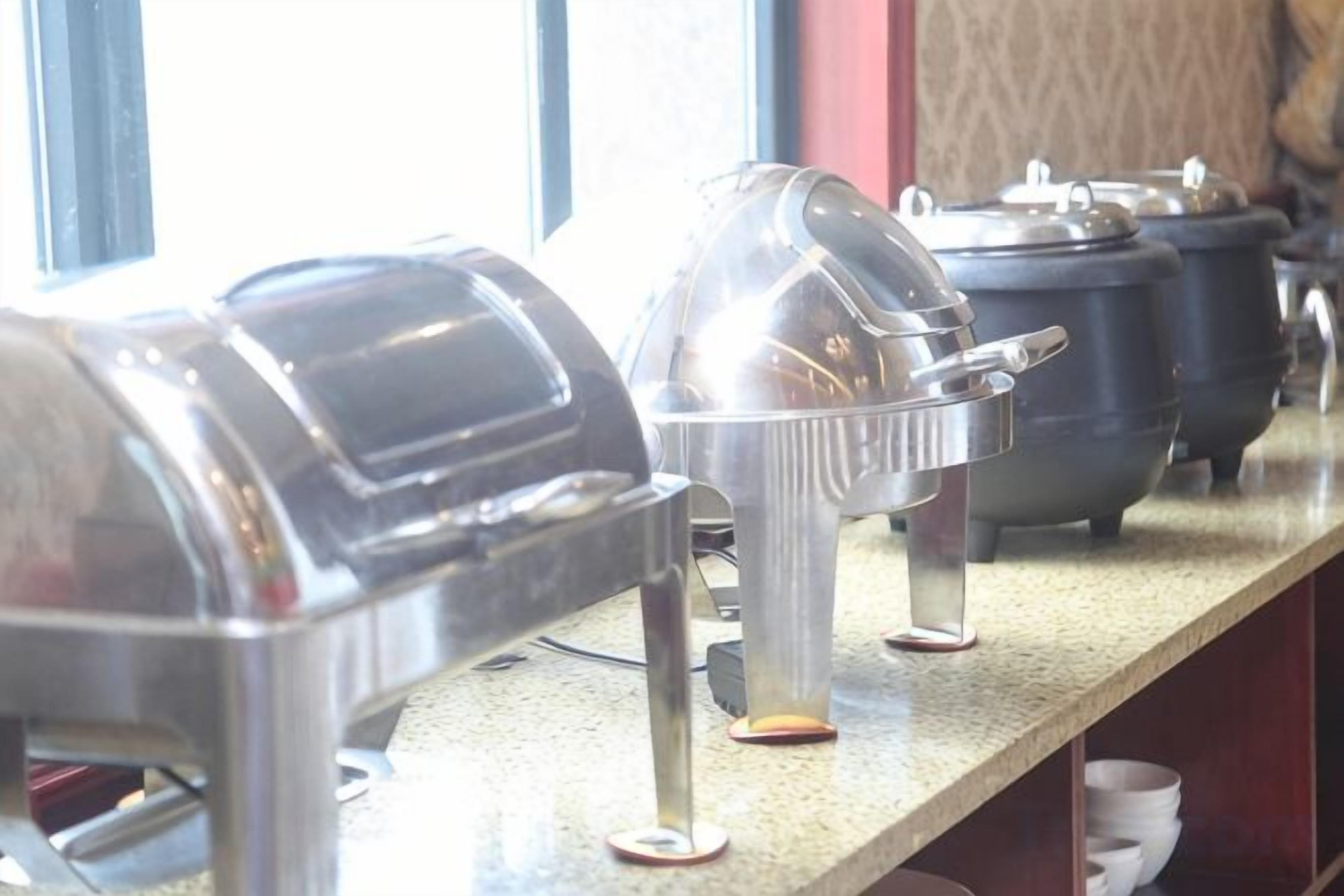 A buffet setup with multiple food service stations.