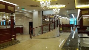 A lobby with marble flooring, a grand staircase, and multiple chandeliers. - GreenTree Inn (Shanghai Jiangyue Road Metro Station) (Shanghai)