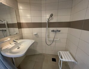 Shower, hair dryer, towels, toilet paper