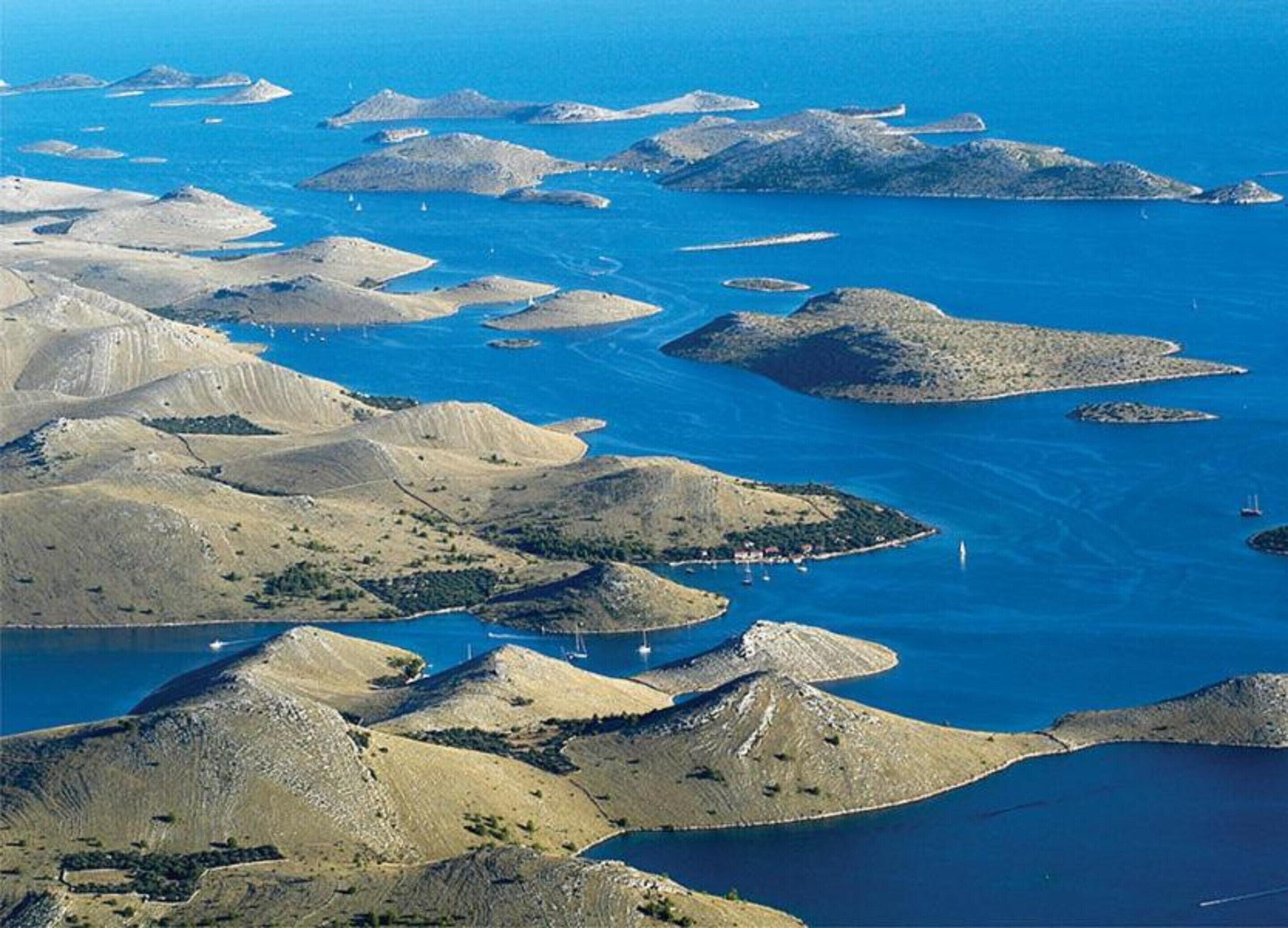 An aerial view of a coastal area with numerous small islands and peninsulas.