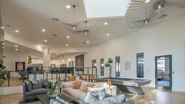 A spacious living area with a pool table, a sofa, and a dining area. - Barrett-Jackson| WestWorld| Heated Pool| Near Mayo (Scottsdale)