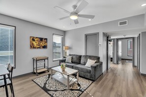 Premier Apartment, 3 Bedrooms, 2 Bathrooms | Living area | 36-inch Smart TV with digital channels, streaming services - New Orleans Bywater Apartments (New Orleans)