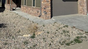 A two-story house with a stone foundation and a garage. - Spacious Mountain Retreat on Golf Course, near Rocky Mountain National Park (Granby)