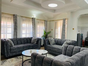 Family Apartment, City View | Living area | 32-inch Smart TV with digital channels - Nati Apartments Kisumu (Kisumu)