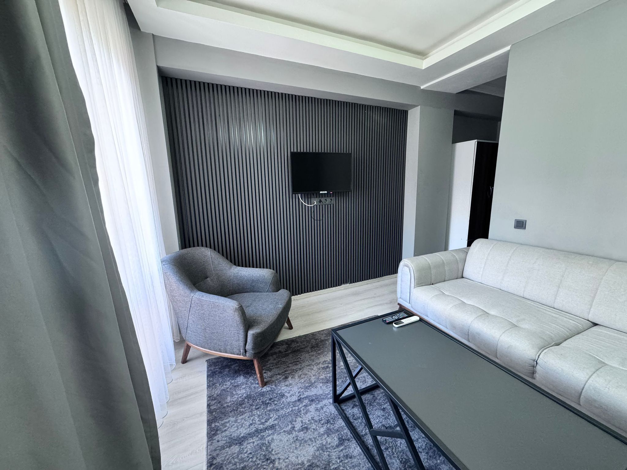 Standard Condo | Living area | 35-inch LED TV with satellite channels