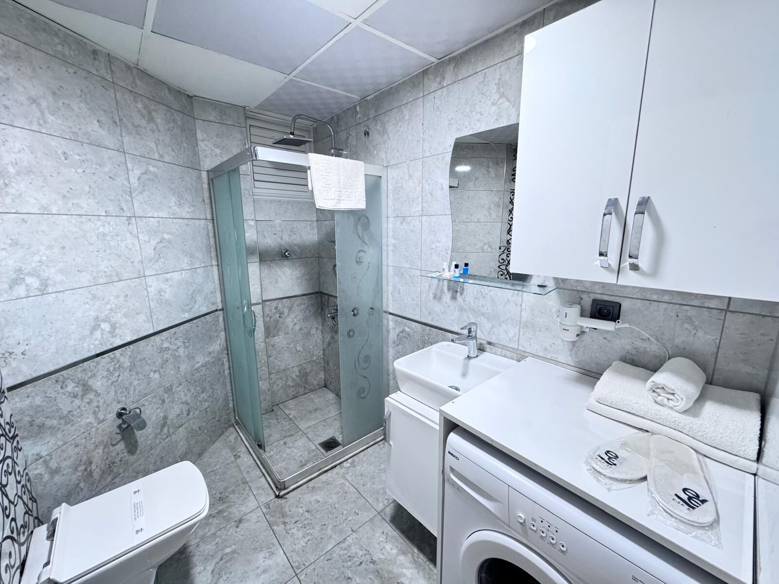 Standard Condo | Bathroom | Shower, free toiletries, hair dryer, slippers