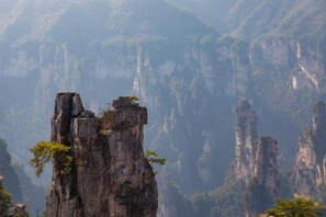 A mountainous landscape with prominent rock formations. - Zhangjiajie Ancient and Modern Inn (Zhangjiajie)