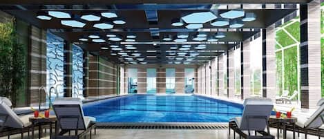 A swimming pool with lounge chairs, a tiled floor, and a ceiling with geometric patterns.