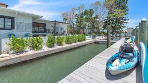 A marina with a dock, a kayak, and a small building with a sign that reads "Office". - Direct Waterfront `The Lily Pad` Walk to Beach (Clearwater Beach)
