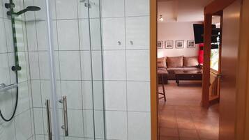 Shower, hair dryer, towels, soap