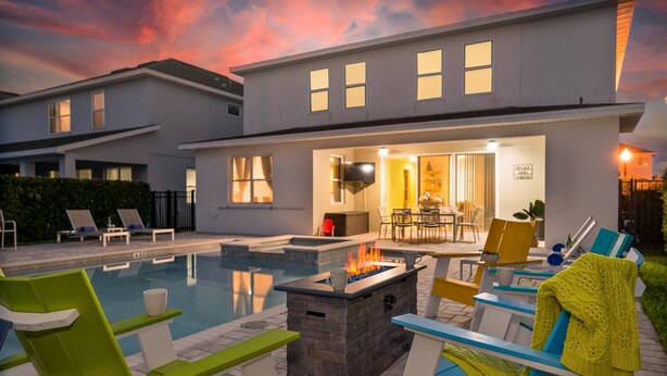 A modern house with a swimming pool, outdoor seating, and a fire pit. - 5BR Gorgeous Villa • Spiderman • Near Disney (Kissimmee)