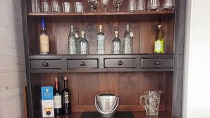 A dark wooden cabinet with multiple shelves, drawers, and a countertop. - Sea la Vie - Margaree farmhouse by river and sea! (Margaree Harbour)