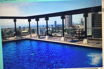 Condo with rooftop swimming and Gym overlooking the famous Ayala Center Cebu.