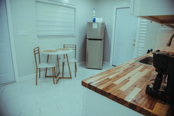 Fridge, microwave, coffee/tea maker, toaster