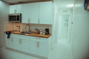 Fridge, microwave, coffee/tea maker, toaster