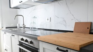 A modern kitchen with a marble backsplash, stainless steel appliances, and a wooden countertop. - SE163 – Senigallia, new one-bedroom apartment with balcony in the town center (Senigallia)