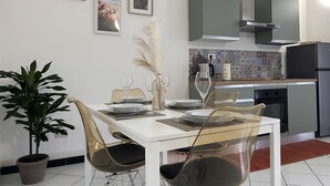 A modern kitchen with a dining area.