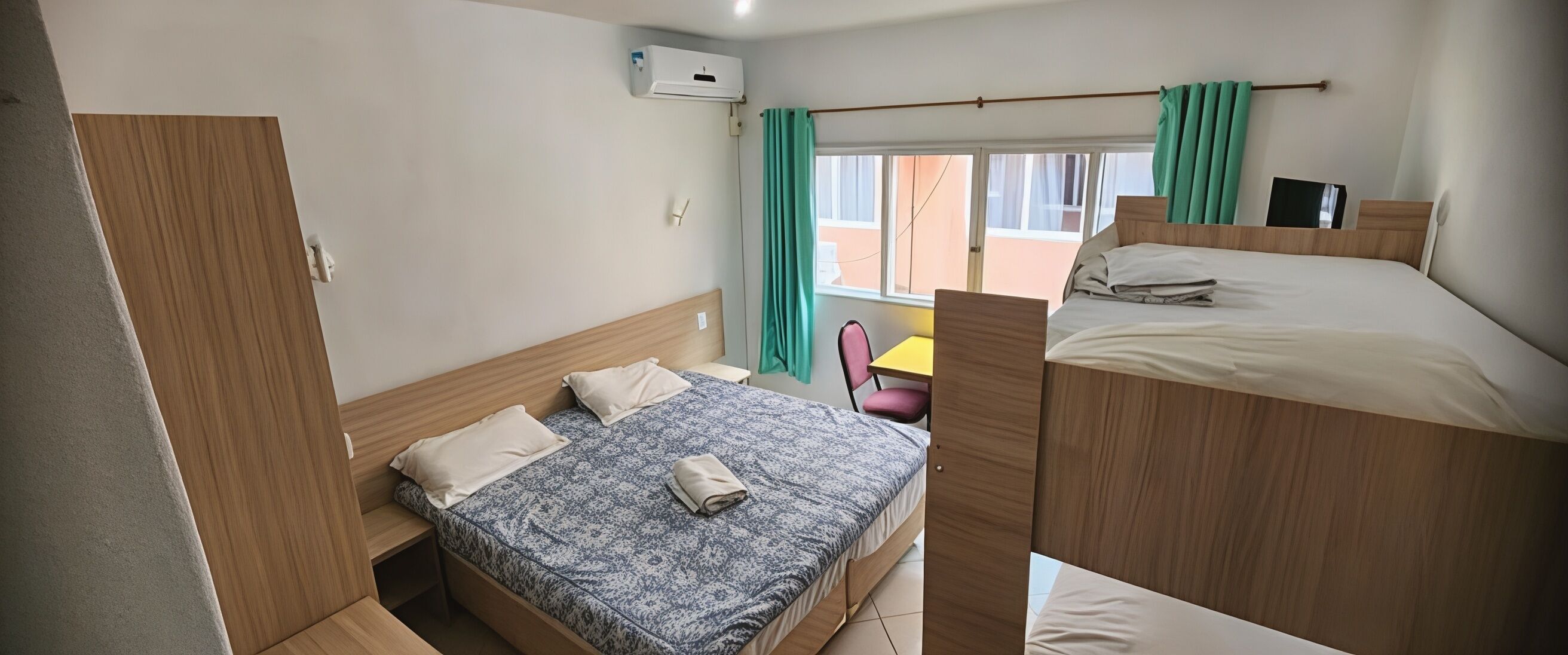 Economy Quadruple Room | Minibar, blackout drapes, free WiFi, bed sheets