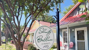 A sign for 'Shanty Bellum' at 211 Madison St. with a porch and red roof. - Shanty Bellum Too | 2/1, Washer/Dryer, Full Kitchen (Natchez)