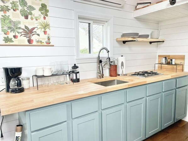 Fridge, microwave, stovetop, coffee/tea maker