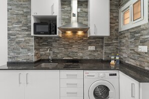 Fridge, microwave, stovetop, coffee/tea maker