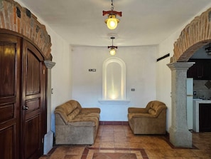 Family Apartment, Garden View | Living area | Flat-screen TV
