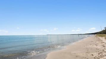 On the beach, sun-loungers, beach towels