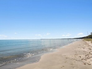 On the beach, sun loungers, beach towels