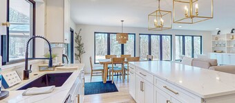 Modern Home in the woods w/ a large patio, gas grill, & near the lake