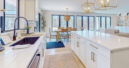 Modern Home in the woods w/ a large patio, gas grill, & near the lake