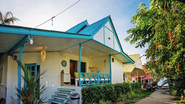 A house with a porch, a staircase, and a small garden. - Dream Villa Beachfront Sunset (Koh Samui)
