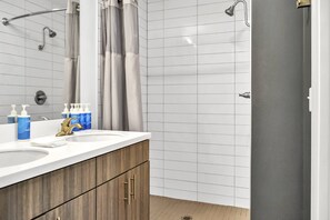 Shower, hair dryer, towels, shampoo