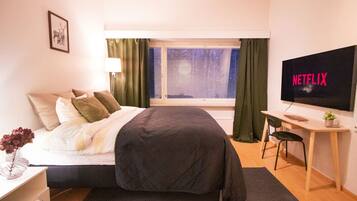 1 bedroom, desk, iron/ironing board, travel crib