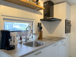 Microwave, stovetop, coffee/tea maker, electric kettle