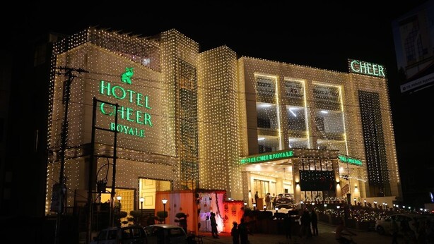 A hotel with a large sign reading "HOTEL CHEER ROYAL DE". - Hotel Cheer Royale (Bareilly)