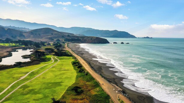 A coastal landscape with a beach, a path, and distant mountains. - 4Beds Private Unit Near BeachWalk Golf (Pacifica)