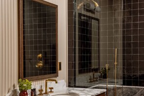 Shower, hair dryer, towels, shampoo