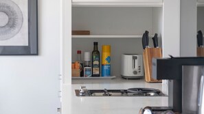 Coffee/tea maker, fridge, microwave, oven