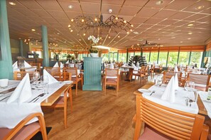 Enjoy a warm and inviting dining experience with comfortable seating and ample space to move.