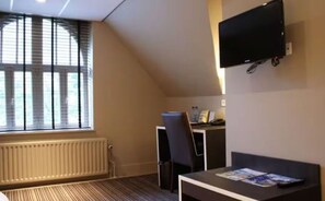 Enjoy a comfortable stay in this modern room with a large window, flat-screen TV, and convenient workspace.