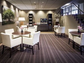 Relax and work in comfort with seating areas and a reception desk at your fingertips.