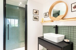 Shower, hair dryer, towels, toilet paper