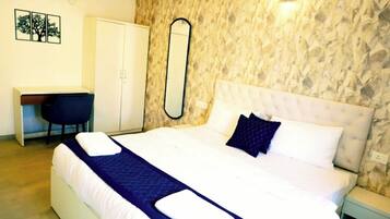 Deluxe Apartment, Balcony, Pool View | Desk, laptop workspace, free WiFi