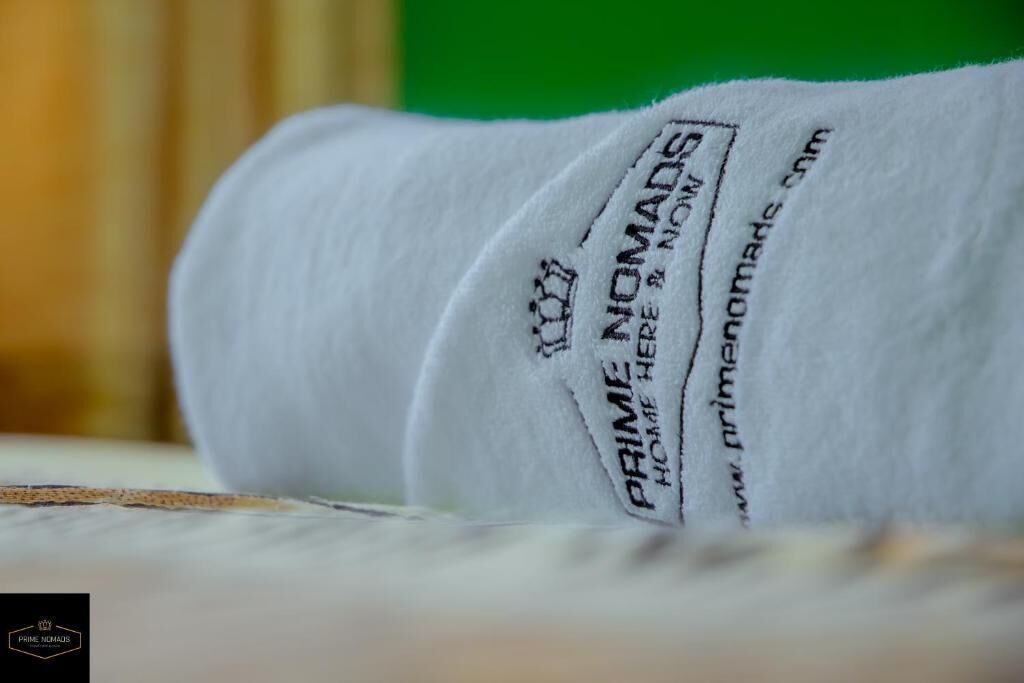 A white fabric with the text "PRIME NOMADS" and a website address.