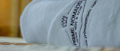 A white fabric with the text "PRIME NOMADS" and a website address.