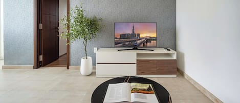 Family Apartment, 1 Bedroom, Balcony, City View | Living area | Flat-screen TV